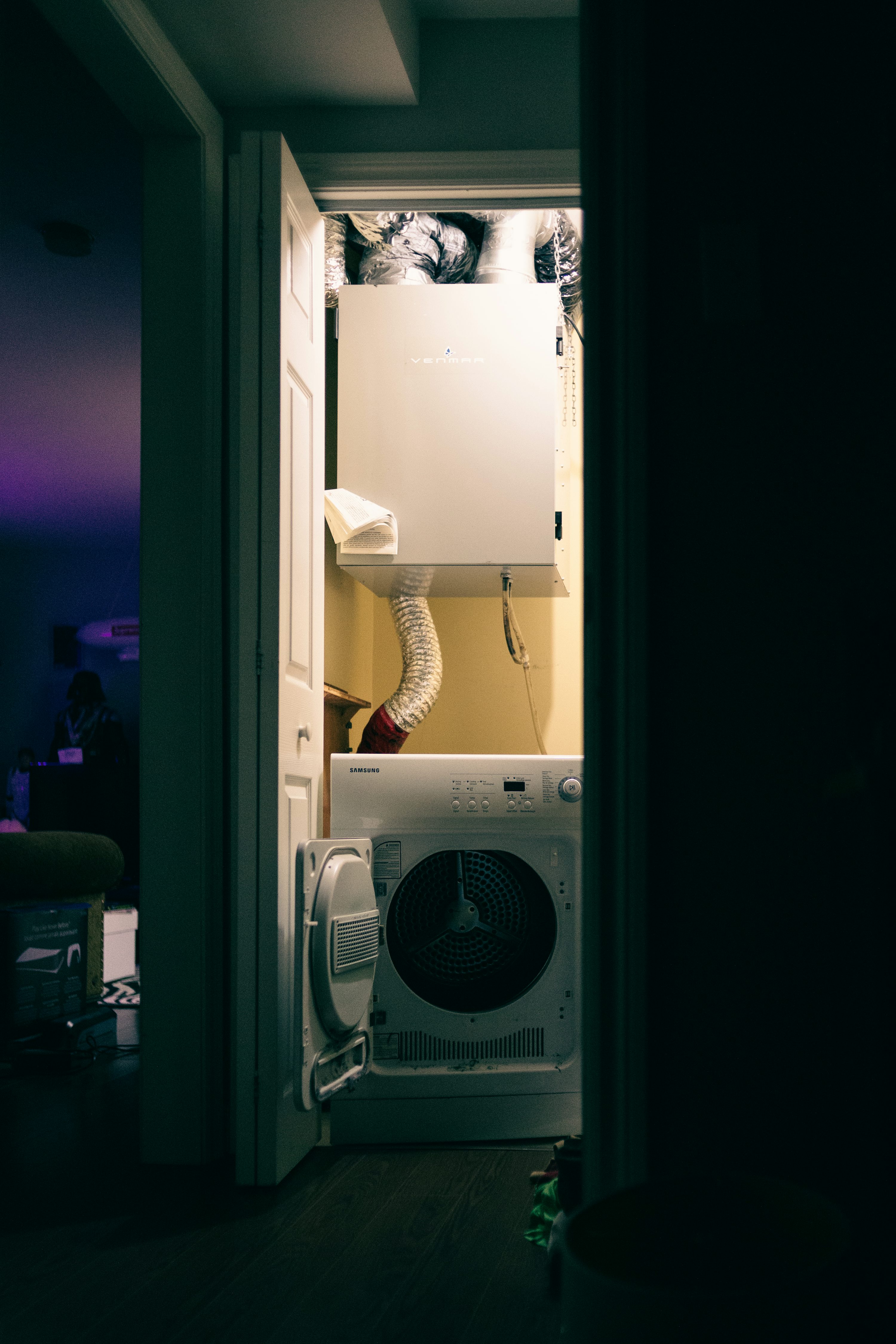 Dryer vent ducting in a residential laundry closet